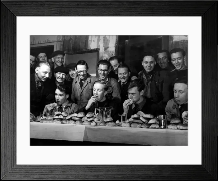 Framed Print : Easter 1951 Four contestants in the annual hot cross bun eating competition Framed Print : Easter 1951 Four contestants in the annual hot cross bun eating competition