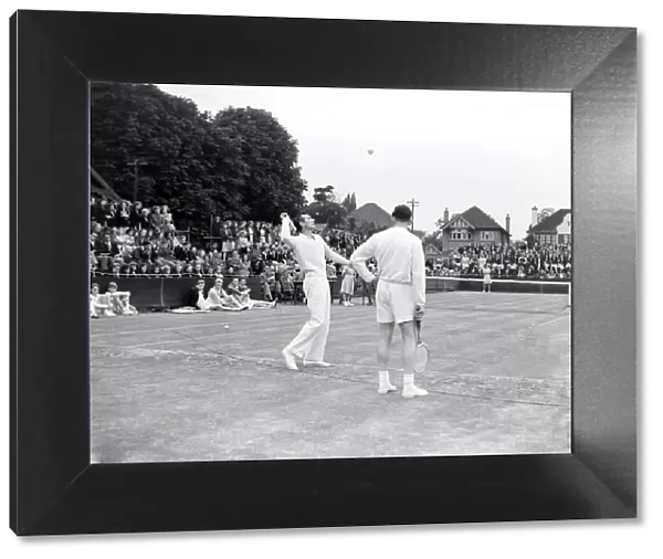 Tennis Fred Perry and Dan Maskell coach children from the Surbiton High School