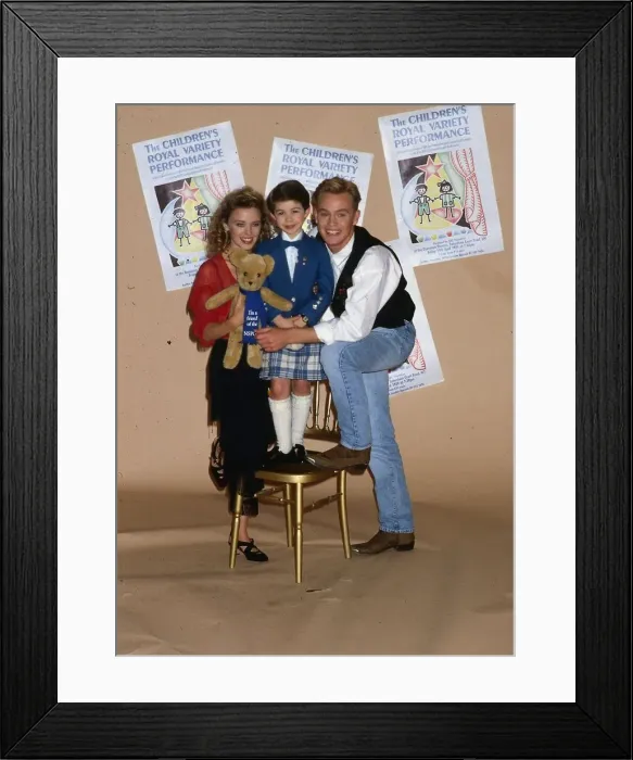 Framed Print : Stuart Anderson April 1989 child Andy Stewart impersonator holding a teddy bear with