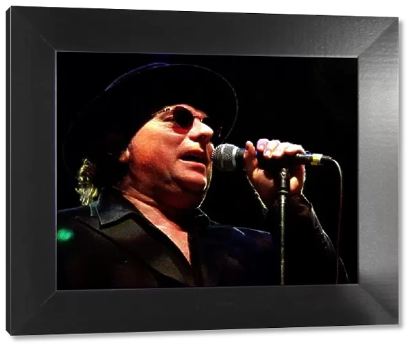 Rock singer Van Morrison hat glasses on stage June 1998