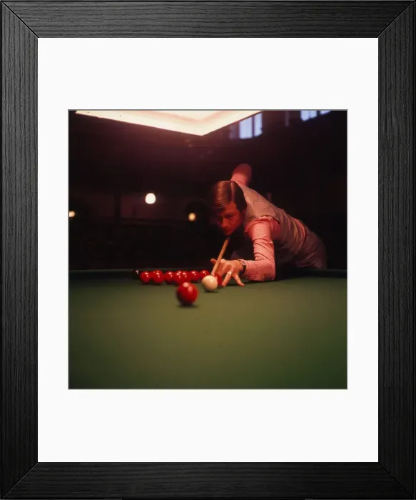 Framed Print : Alex Higgins, snooker player about to play a shot. Circa 1972