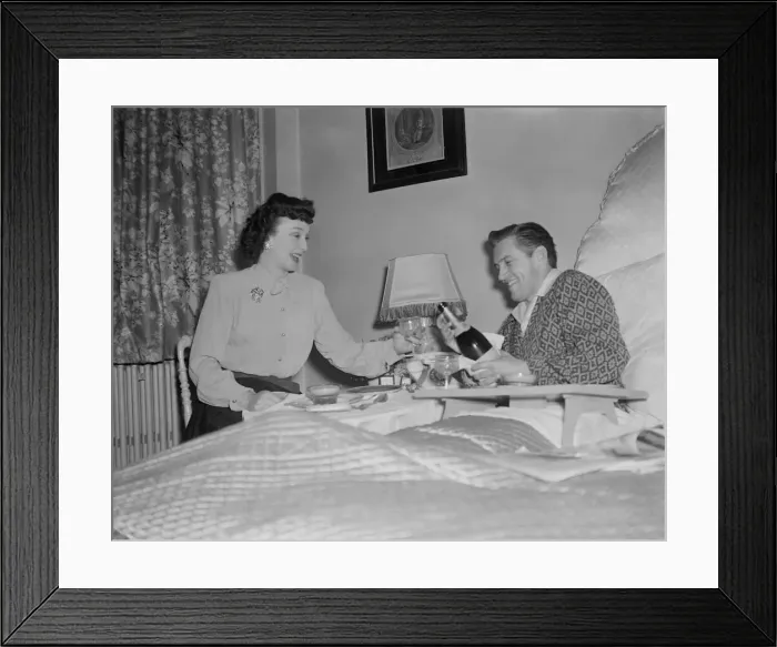 Framed Print : Film stars celebrate 1st Wedding Anniversary. 1949 John McCallum in bed with Framed Print : Film stars celebrate 1st Wedding Anniversary. 1949 John McCallum in bed with