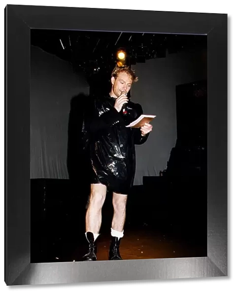 Jason Donovan Mr Gay UK contest compere wearing black bin bag microphone boots