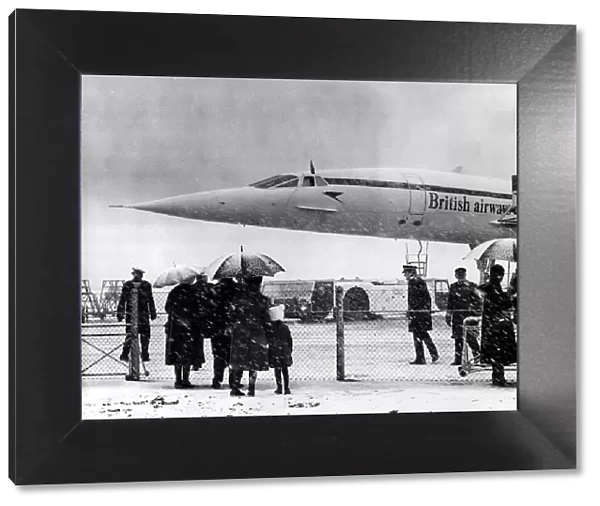 Concorde about to leave Heathrow airport in the snow with the Queen