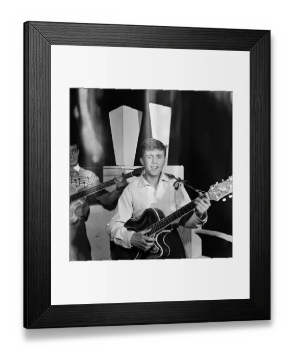 Framed Print : British singer Terry Dene playing guitar as he performs on stage at a Derby theatre Framed Print : British singer Terry Dene playing guitar as he performs on stage at a Derby theatre