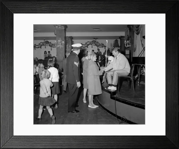 Framed Print : Fans welcome the return of pop singer Johnny Leyton at a fan club concert at the Empire