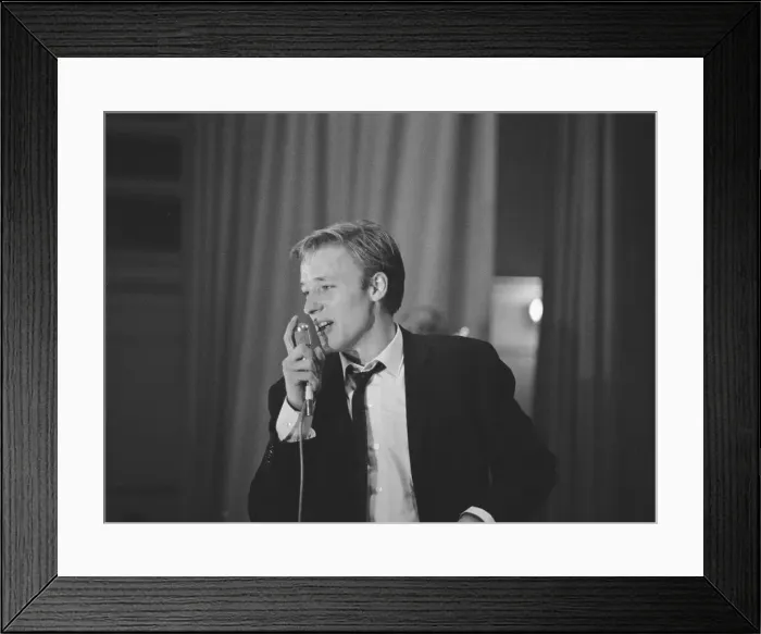 Framed Print : British pop singer Mike Sarne performing on stage with his band