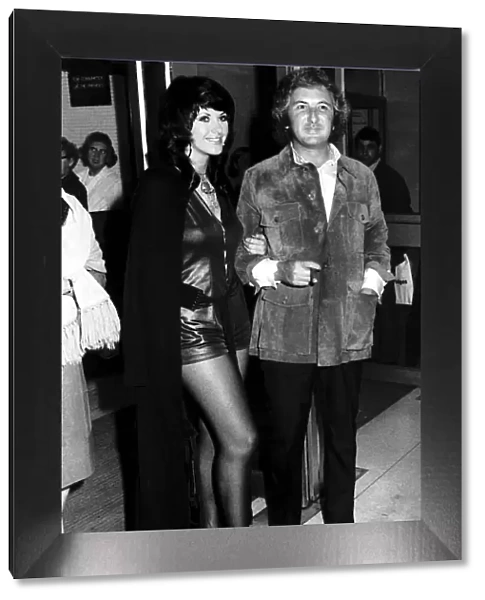 Film Producer Michael Winnner is accompanied by model Valli Kemp at a Film Premiere of
