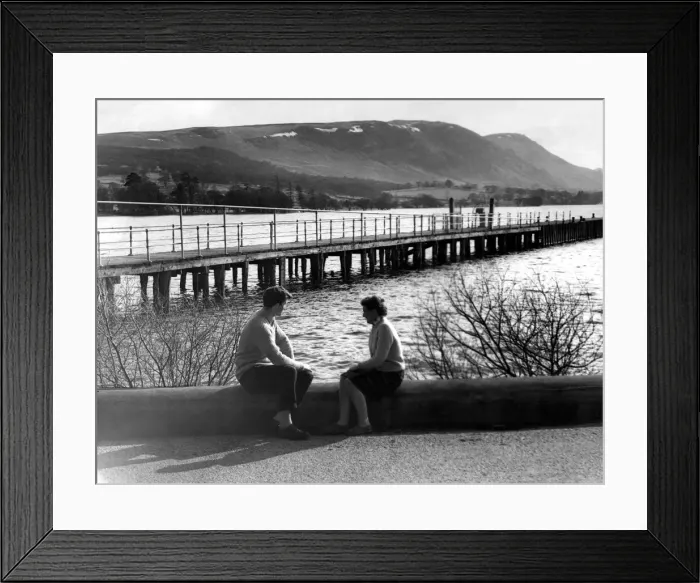 Framed Print : Lake District - A couple sit at the waters edge at Ullswater 19 March 1963 Framed Print : Lake District - A couple sit at the waters edge at Ullswater 19 March 1963