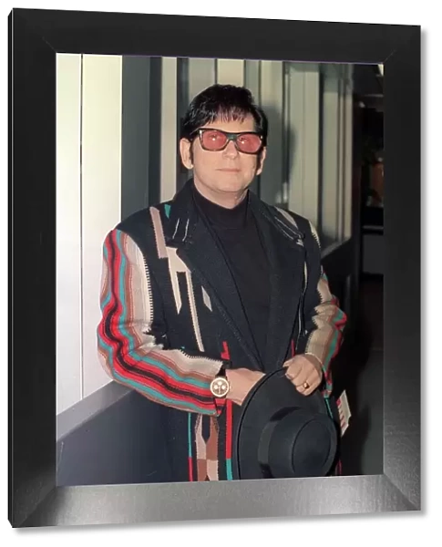 Roy Orbison at Heathrow Airport November 1988 in multi coloured coat
