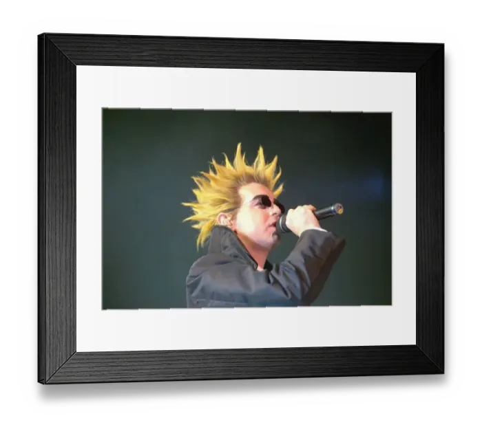 Framed Print : Neil Tennant of The Pet Shop Boys on stage at the Newcastle Telewest Arena. 07  /  12  /  99