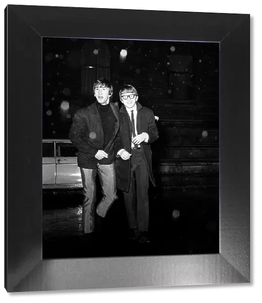 Pop stars Peter and Gordon alias Peter Asher and Gordon Waller leave a party at number