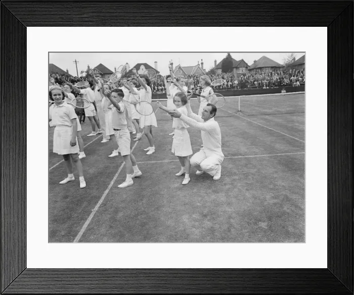 Framed Print : Tennis Fred Perry coaches children from the Surbiton High School
