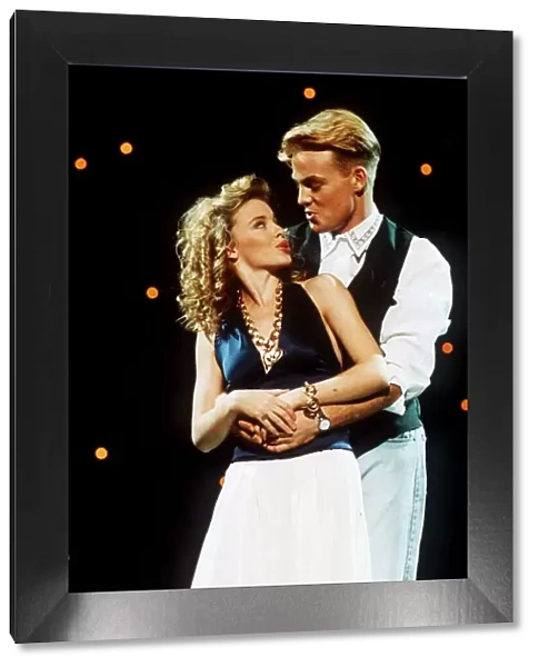 Jason Donovan actor singer arms round Kylie Minogue