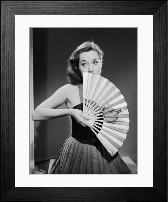 Framed Print : Model with fan in strapless dress. Model with fan in strapless dress. Circa 1964 Framed Print : Model with fan in strapless dress. Model with fan in strapless dress. Circa 1964