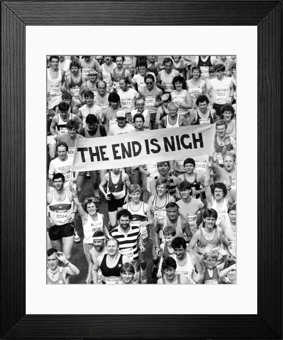 Framed Print : The Great North Run 30 June 1985 - Fun runners carrying a banner featuring the
