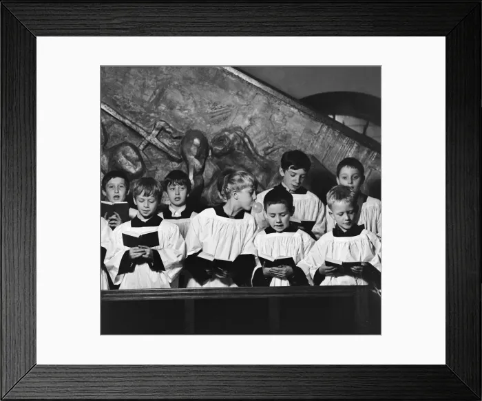 Framed Print : Ten year old choirboy Ian Stacey of Bethnal Green tries to break the concentration of his Framed Print : Ten year old choirboy Ian Stacey of Bethnal Green tries to break the concentration of his