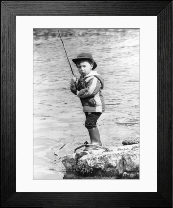 Framed Print : George Miller, Scotlands youngest angler, who can be spotted regularly at the Leven Framed Print : George Miller, Scotlands youngest angler, who can be spotted regularly at the Leven
