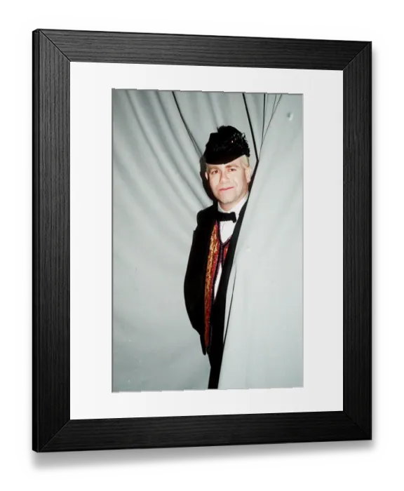 Framed Print : Elton John concert Palais de Sports Paris cap bow tie standing in curtain