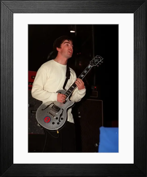 Framed Print : Noel Gallagher of the pop group Oasis on stage Sept 97 Framed Print : Noel Gallagher of the pop group Oasis on stage Sept 97