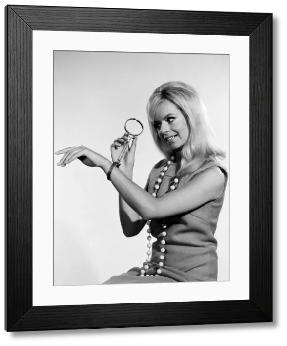 Framed Print : Handcuffs feature. Circa 1964