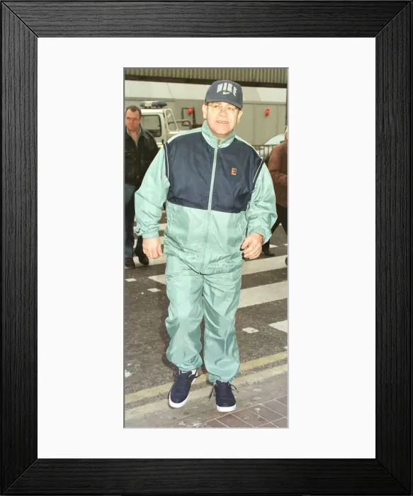 Framed Print : Sir Elton John leaving Heathrow on his way March 1998 to Australia