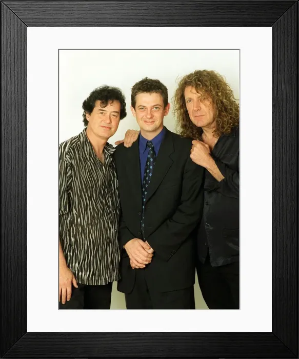 Framed Print : Jimmy Page former lead guitarist of the pop group Lead Zeppelin with Robert Plant former