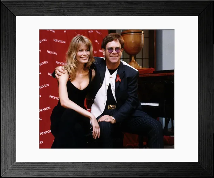 Framed Print : Elton John singer with model Claudia Schiffer Framed Print : Elton John singer with model Claudia Schiffer