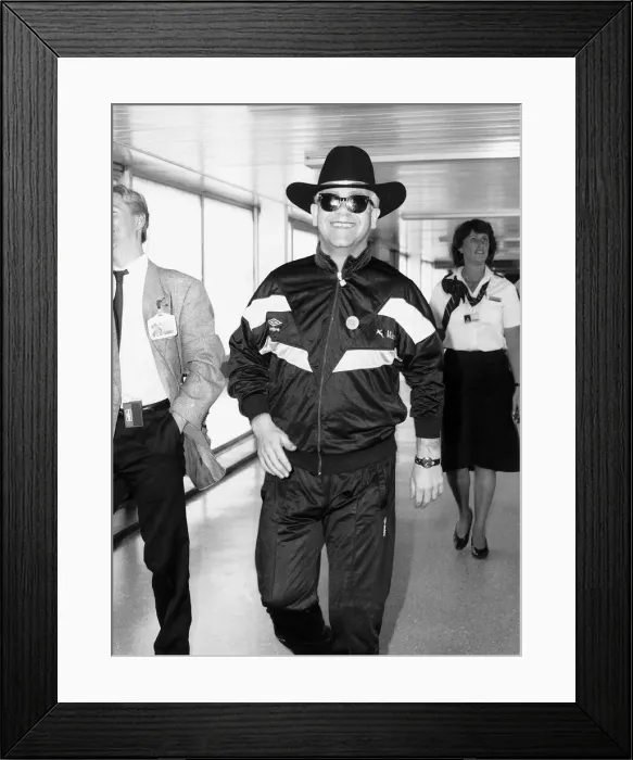 Framed Print : Elton john the singer arriving at Heathrow airport after the latest tour