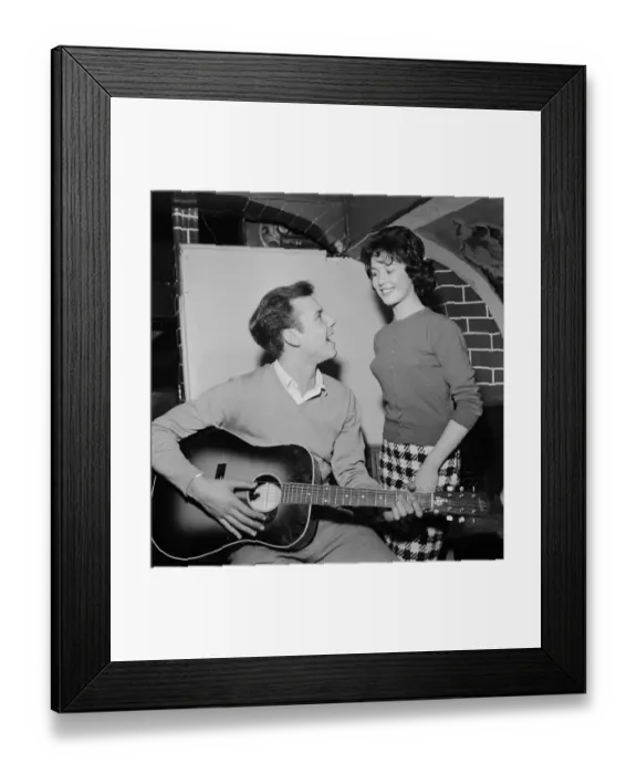Framed Print : Singer Marty Wilde sings to his fiancee Joyce Baker (18), 28th October 1959
