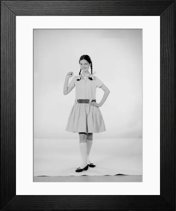 Framed Print : Model Jennifer Goddard. Brown-haired girl in checkered dress with pig tails Framed Print : Model Jennifer Goddard. Brown-haired girl in checkered dress with pig tails