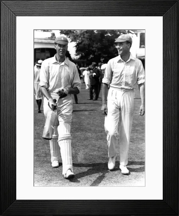 Framed Print : Kent v Middlesex at Canterbury. Frank Woolley of Kent on the left walks out to bat