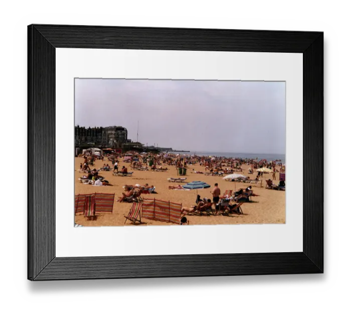 Framed Print : Margate Beach with tourists and daytrippers sunbathing. People sitting on deck chairs