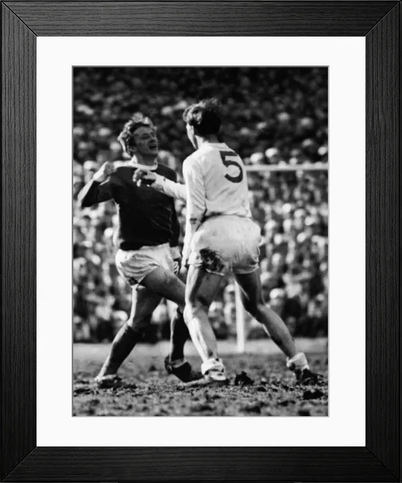 Framed Print : English FA Cup Manchester United 0-0 Leeds United. Denis Law raises his fist to Framed Print : English FA Cup Manchester United 0-0 Leeds United. Denis Law raises his fist to