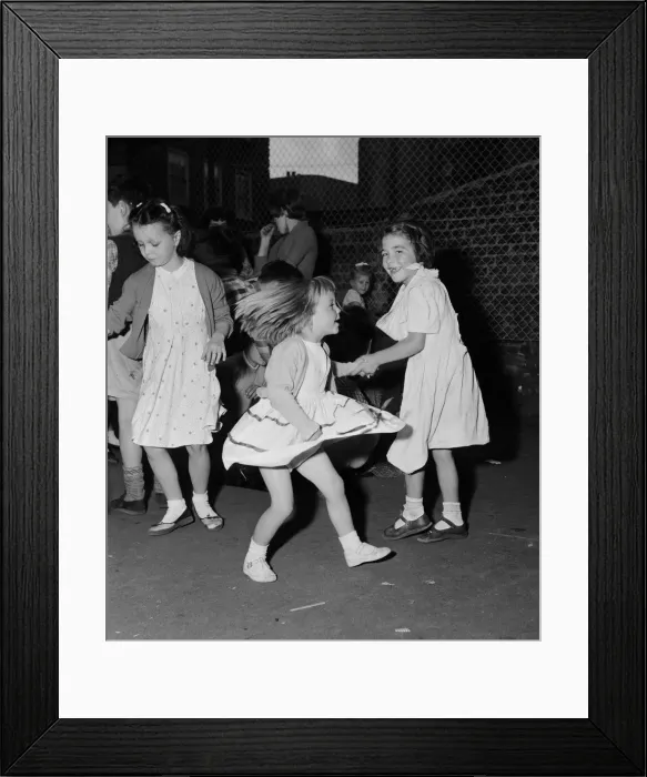 Framed Print : Children dancing to rock n roll music at a block of flats off Chapel Market