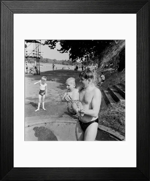 Framed Print : Londons Hyde Park Lido. A father and young son having a shower at the Serpentine Framed Print : Londons Hyde Park Lido. A father and young son having a shower at the Serpentine