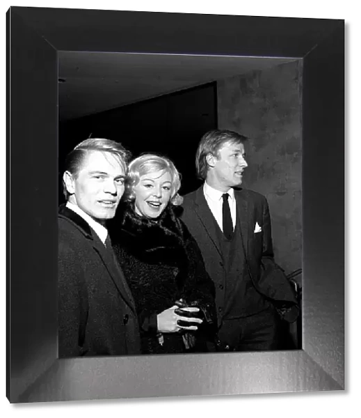 Pop stars Adam Faith, Kathy Kirby and Mike Sarne arriving at the Empire theatre in