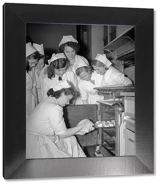 Students of Elizabeth Newcomen School in Southwark, London gather round the oven to see