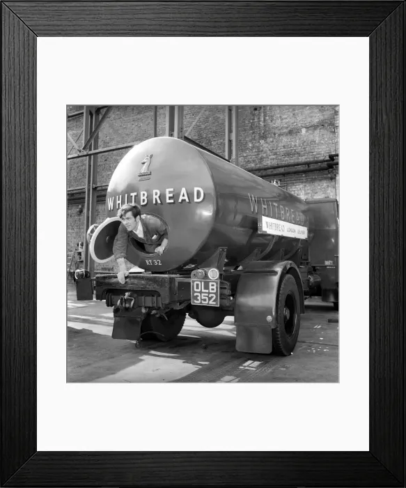 Framed Print : A tanker driver seen here cleaning out the inside of his vehicle at the Whitbread brewery Framed Print : A tanker driver seen here cleaning out the inside of his vehicle at the Whitbread brewery