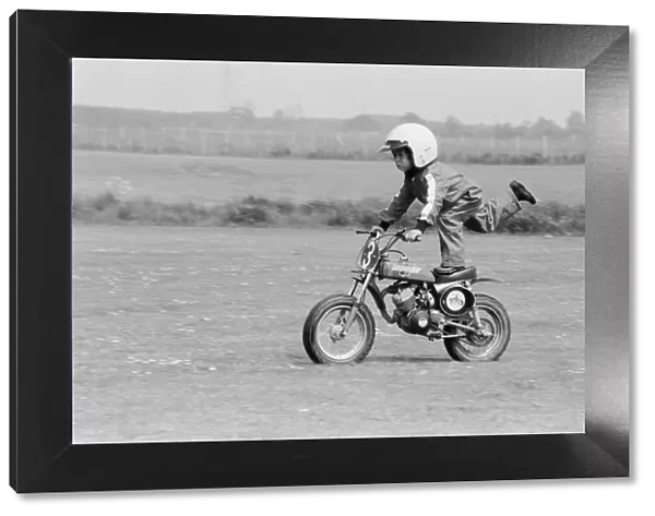 Four year old Jarno Barratt of Corby, Northamptonshire, performs a stunt on his 50 cc