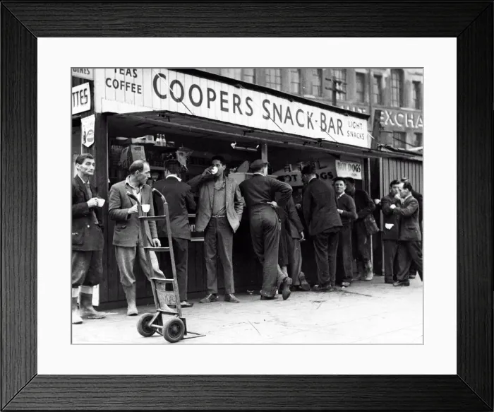 Framed Print : A cup of tea makes a welcome break for these men, many of whom have been working in