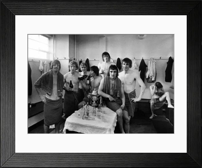 Framed Print : Manchester United players celebrate in the changing rooms after being promoted back into Framed Print : Manchester United players celebrate in the changing rooms after being promoted back into