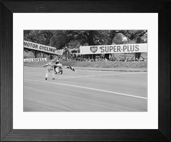 Framed Print : Motor Cycle Racing at oulton Park. Phil read takes the chequered flag after winning Framed Print : Motor Cycle Racing at oulton Park. Phil read takes the chequered flag after winning