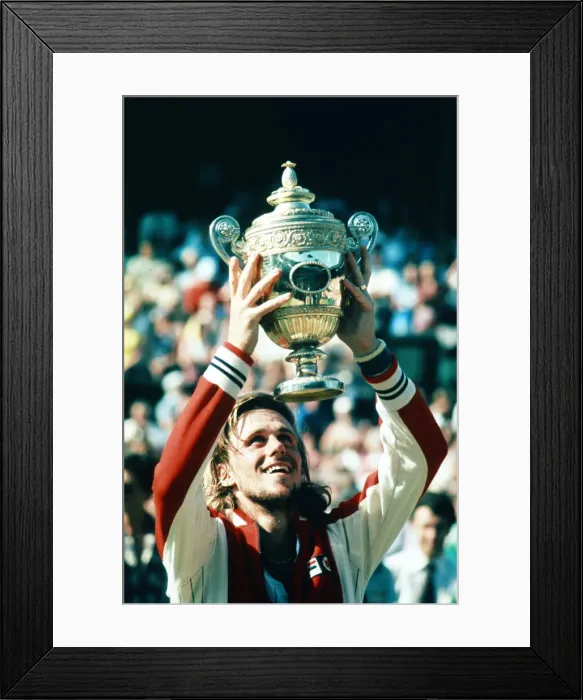 Framed Print : Wimbledon 1977. Bjorn Borg holds up the trophy after winning the men Framed Print : Wimbledon 1977. Bjorn Borg holds up the trophy after winning the men