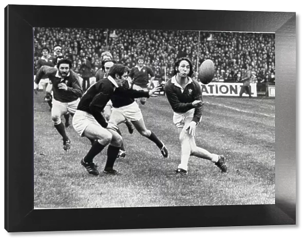 WALES V SCOTLAND 1976- PICTURE SHOWS: Man-of-the-series J. P. R. Williams passes out to J