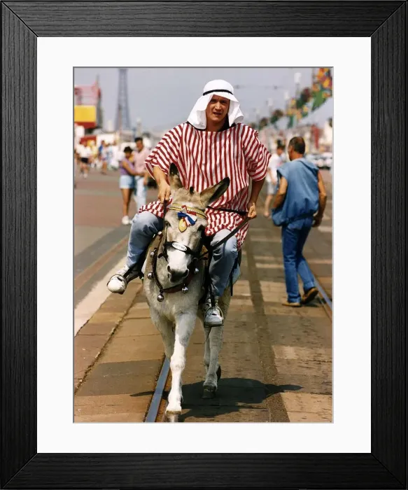 Framed Print : Peter Howitt Actor riding on a donkey A©Mirrorpix