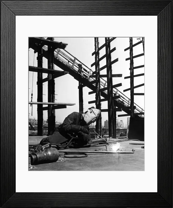 Framed Print : A welder puts together sectons of a ship in the Scottish shipyard Circa 1955 Framed Print : A welder puts together sectons of a ship in the Scottish shipyard Circa 1955