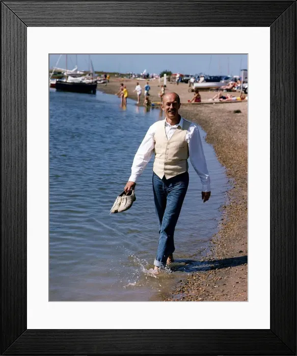 Framed Print : Roy Marsden actor walking along beach paddling in water Framed Print : Roy Marsden actor walking along beach paddling in water