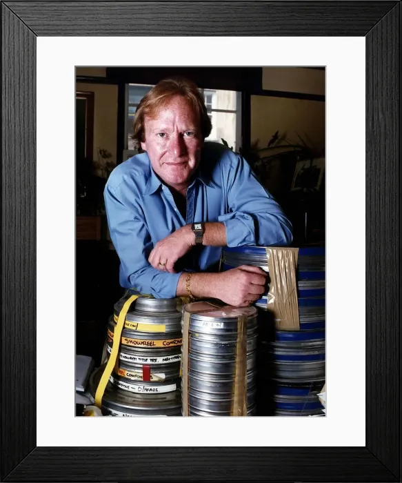Framed Print : Denis Waterman actor who was in the Minder leans on Film Cans Dbase Framed Print : Denis Waterman actor who was in the Minder leans on Film Cans Dbase