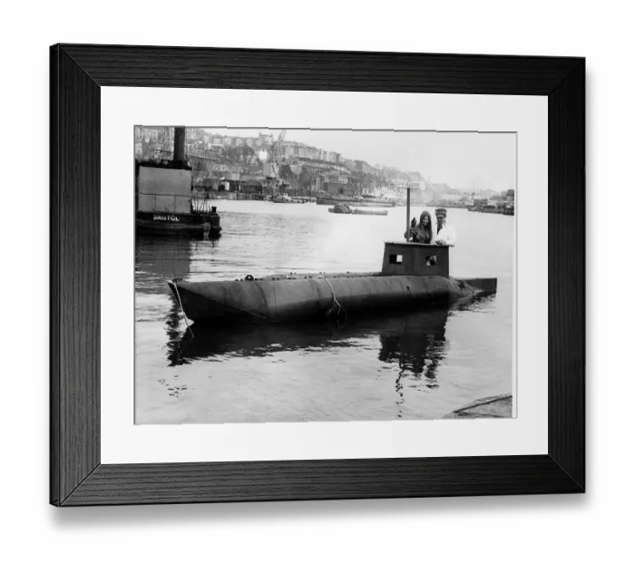 Framed Print : Garage owner Douglas Price with daughter Zena in the semi submarine he built called